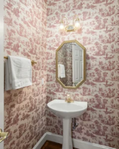 Classic bathroom vanity with decorative cabinetry and brass fittings